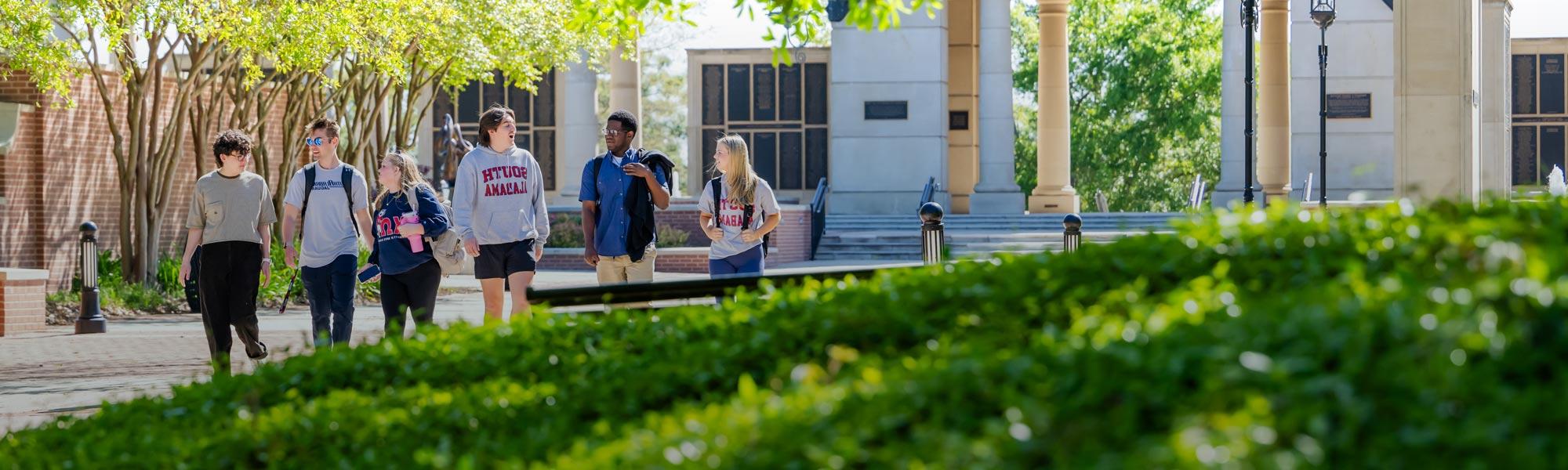 Group of students walking in front of 默尔顿塔